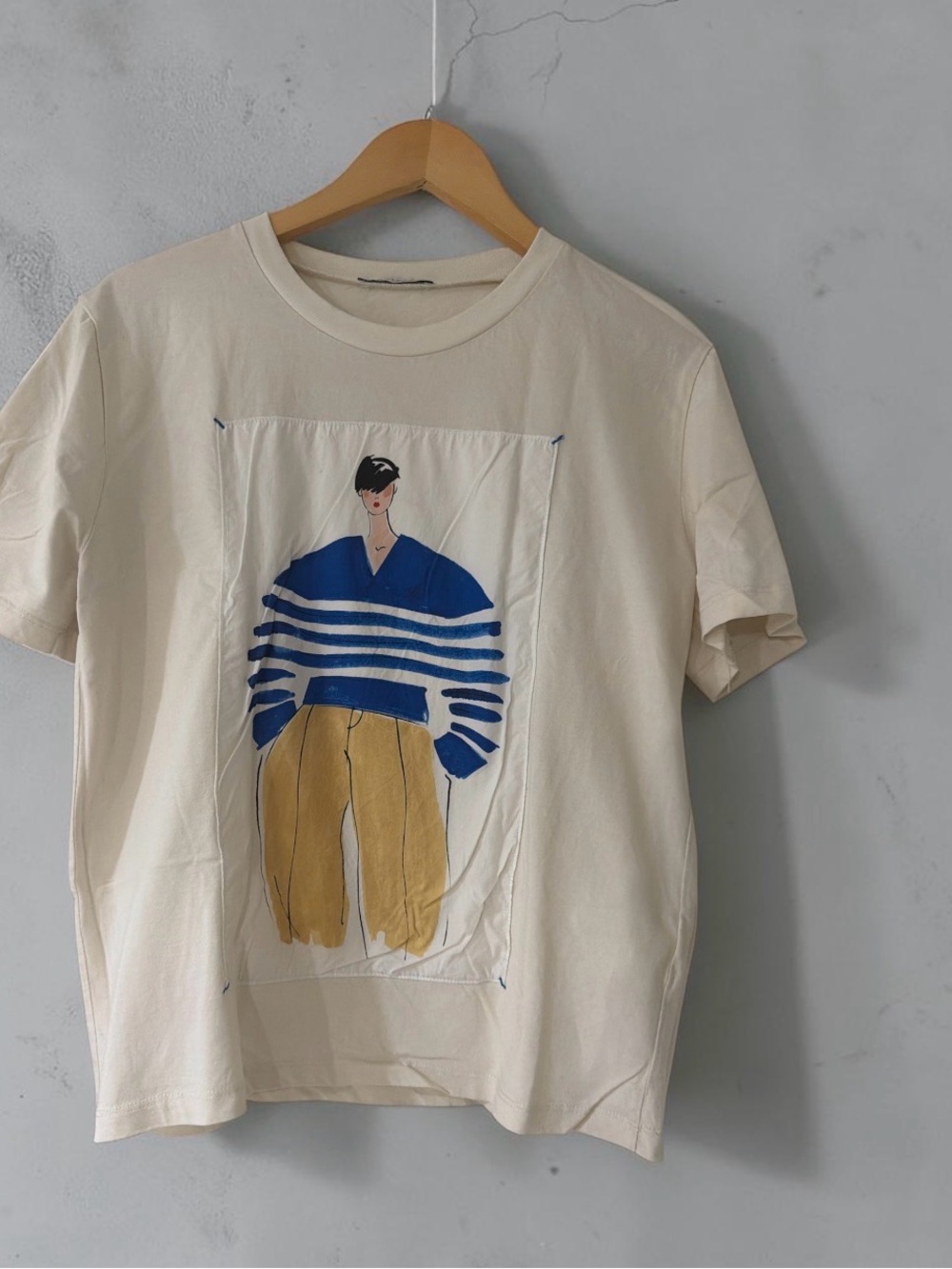 Zara Cream Tee with Blue Striped Illustration and Mustard Trousers